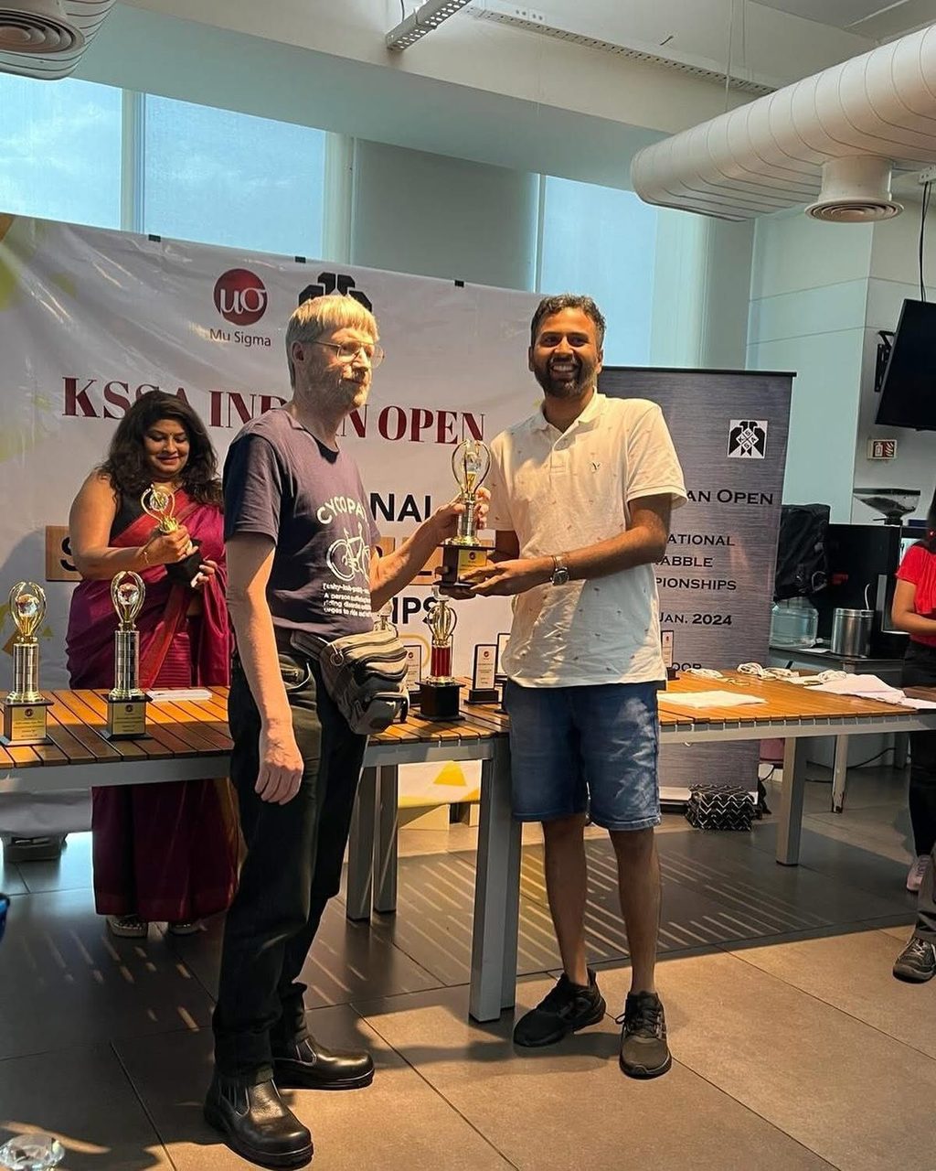 Sid receiving a trophy at the KSSA Indian Open